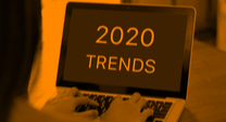 woman's hands on a laptop computer with 2020 Trends on the screen