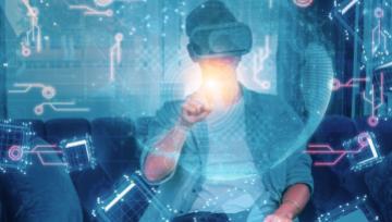 person wearing AI headset touching a techy hologram