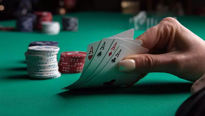 poker hand of 4 aces