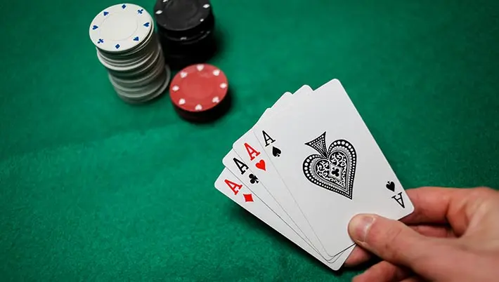 poker hand of 4 aces
