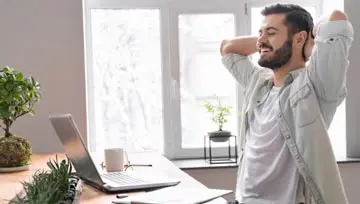 Man looking at his laptop