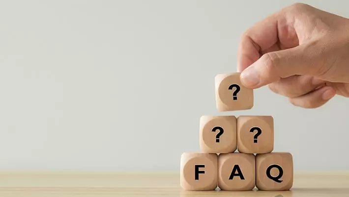 cubes spelling out “FAQ” and cubes with question marks 