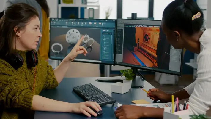 game designer at work programming on his computer