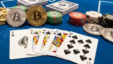 Bitcoin coins and playing cards