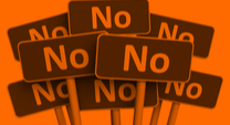 a bunch of red signs that say NO