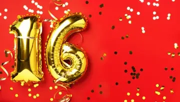 "16" balloon gold decoration set against a festive red background