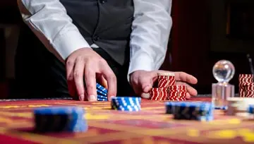 hands holding casino chips  