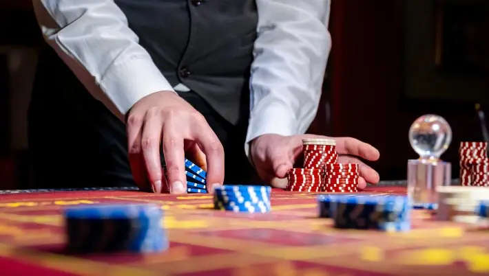 hands holding casino chips  