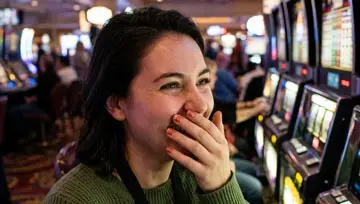 Woman standing in front of slot machines 
