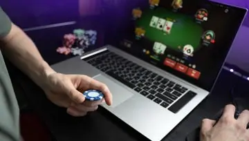 laptop screen showing online poker game 