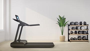 treadmill with a computer screen in an exercise room with a rack of barbells