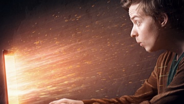 gamer playing on his screen exploding with excitement