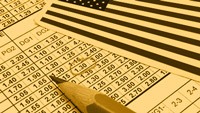 a sports book lying on the table on a US flag