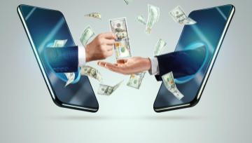 hands reaching out of cell phones passing money from one to the other