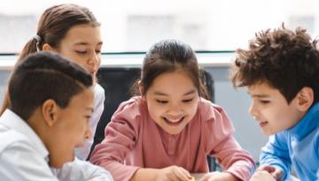 kids in classroom playing a game 