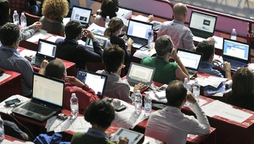 room of sports journalists reporting esports events