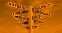street signs each pointing in a different direction with the flags and names of European countries