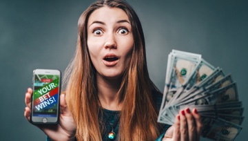 woman holding her phone