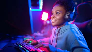 woman gamer playing on her computer