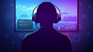 young gamer sitting in front of a screen 